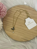 Collana Metamorfosi in Acciaio Dorato con Farfalla e Punto Luce
