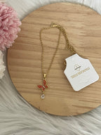 Collana Metamorfosi in Acciaio Dorato con Farfalla e Punto Luce